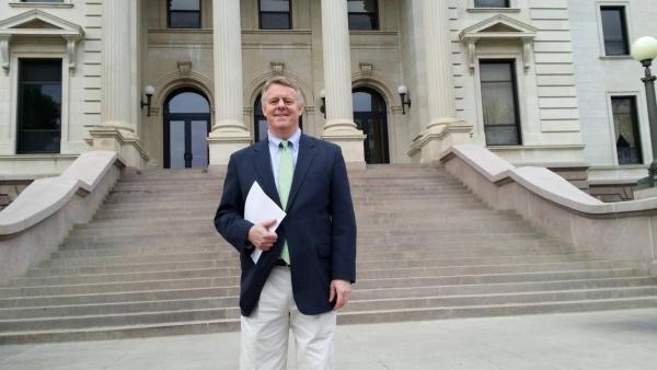 Issuing a report at the South Dakota state capitol.